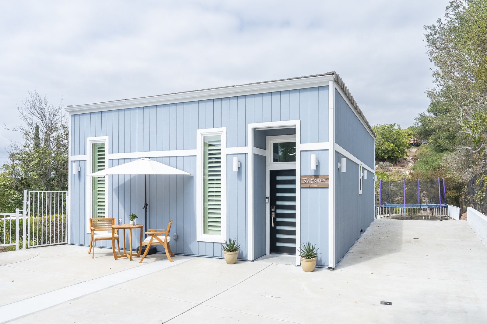 Rancho Bernardo garage converted into a detached ADU with a covered entry and a patio set