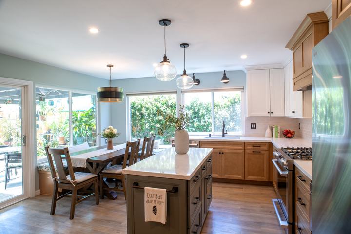 Kitchen looking toward the banquette and patio doors past the island