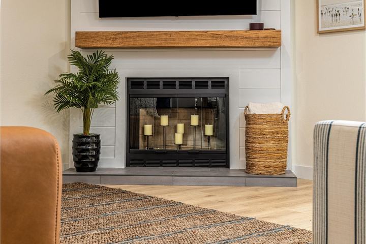 Shiplap fireplace with wood mantel and tile hearth
