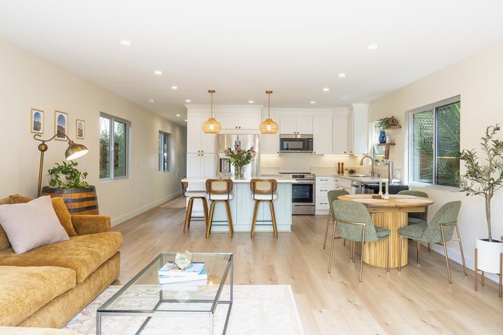 Open kitchen with island seating and coastal palette in Pacific Beach