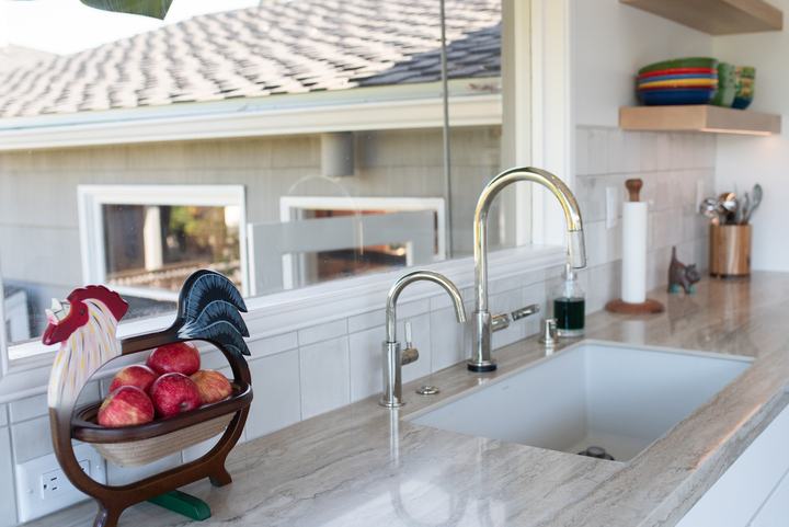 Polished nickel Brizo kitchen faucet and beverage faucet at the sink