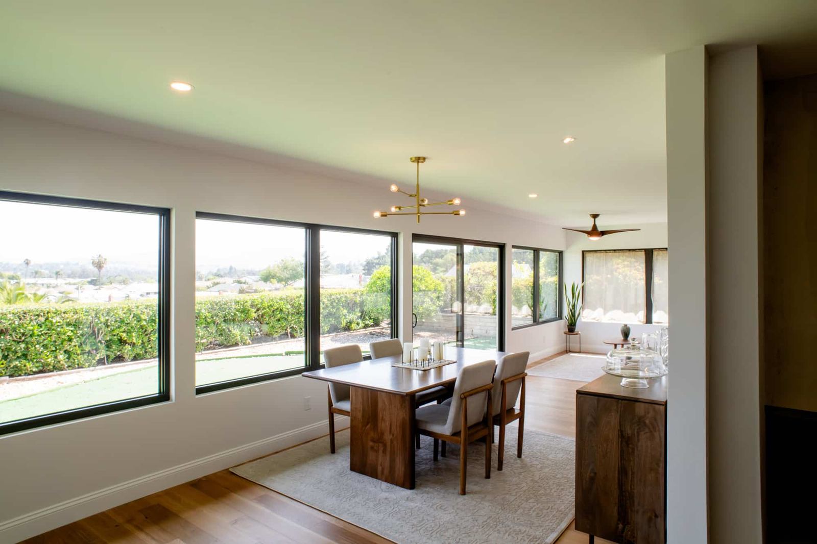 Dining and living area with wide windows in a Rancho Bernardo addition remodel