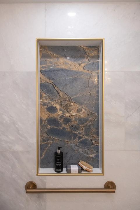Gold inlays in Walk in Shower