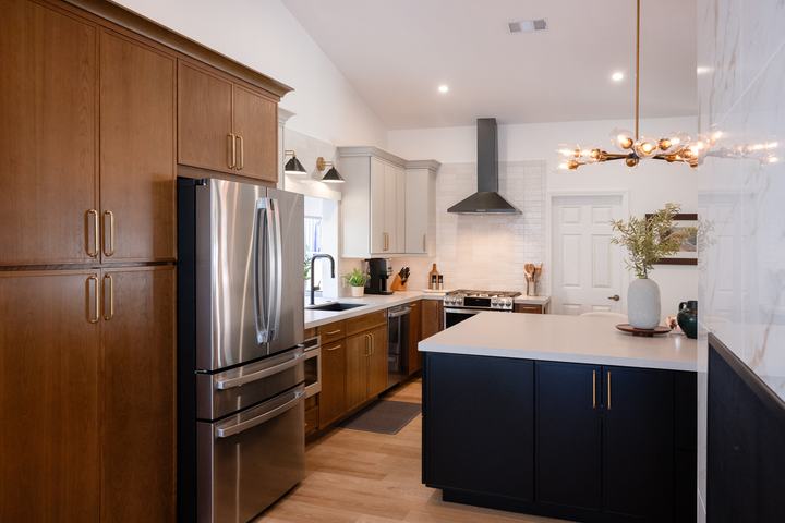 Kitchen with mixed-tone cabinets and oversized island
