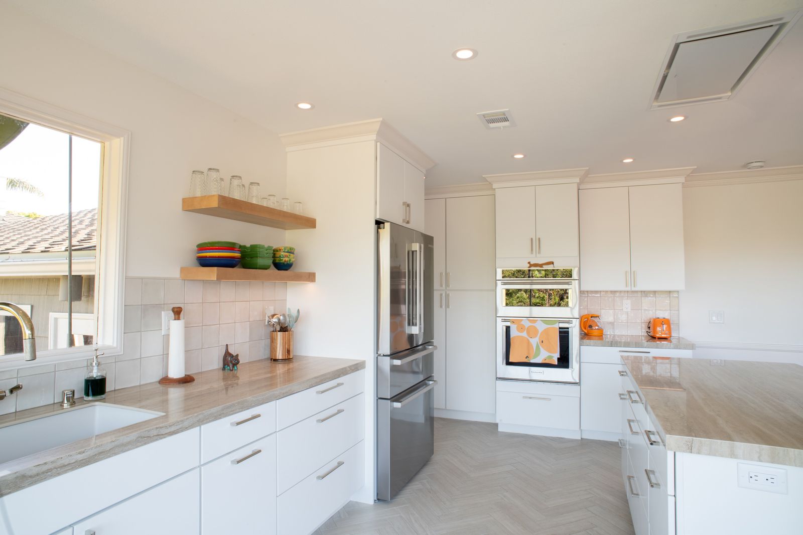 Point Loma kitchen remodel with white cabinets and a hidden induction cooktop
